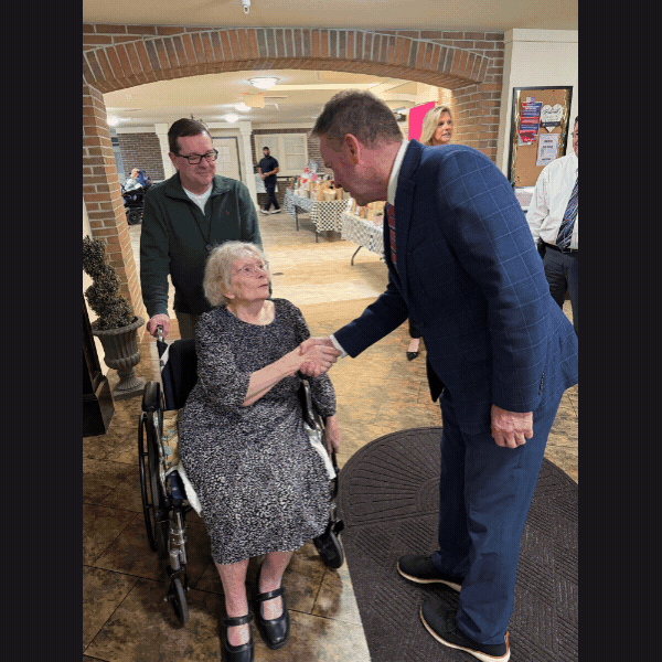 Slideshow of photos of Sen. Laughlin shaking hands with Fairview Manor residents and nursing home administration.